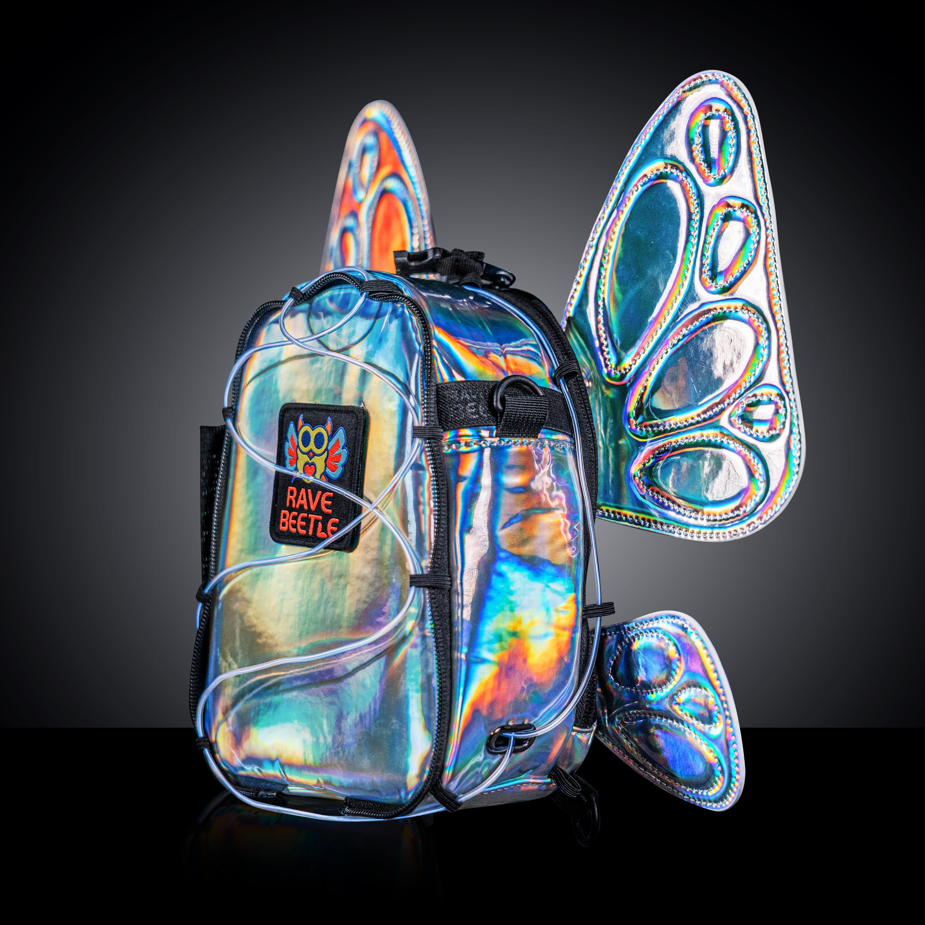 RaveBeetle FLOWt Pin Display Hydration Festival Pack โ Swappable Wing Rave Backpack with 8oz Soft Water Bottle & Light Accessory (Silver)